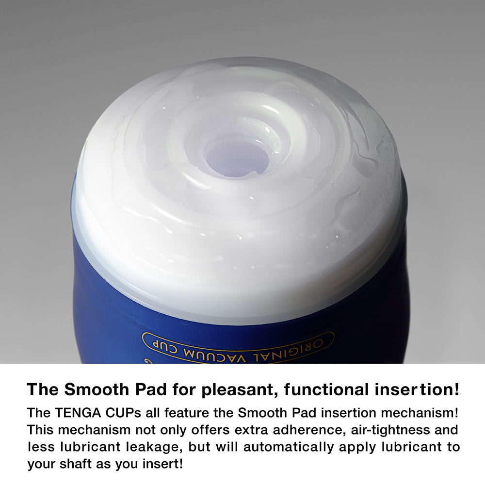 Close-up of a blue and white Tenga vacuum cup with a textured white opening.
