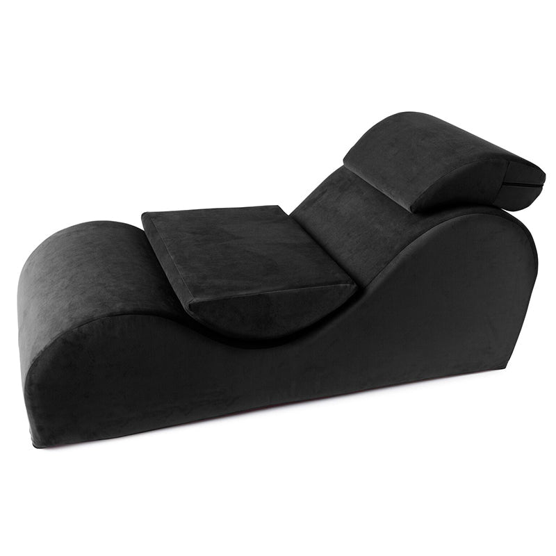 Black microvelvet chaise lounge with adjustable headrest.