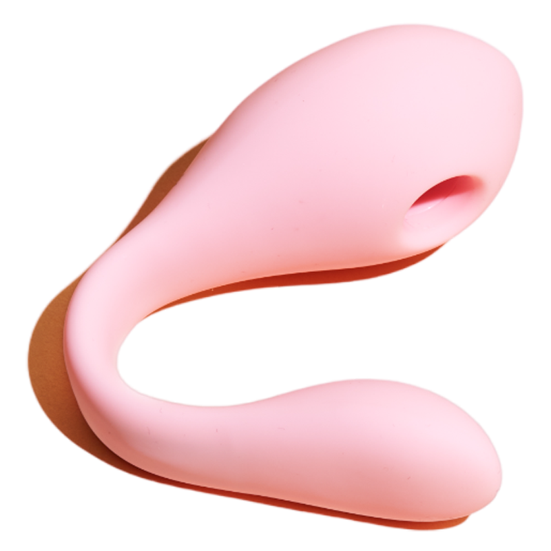 Pink dual stimulation suction vibrator with a curved design.