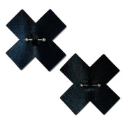 Black cross pasties with pierced barbell detail.