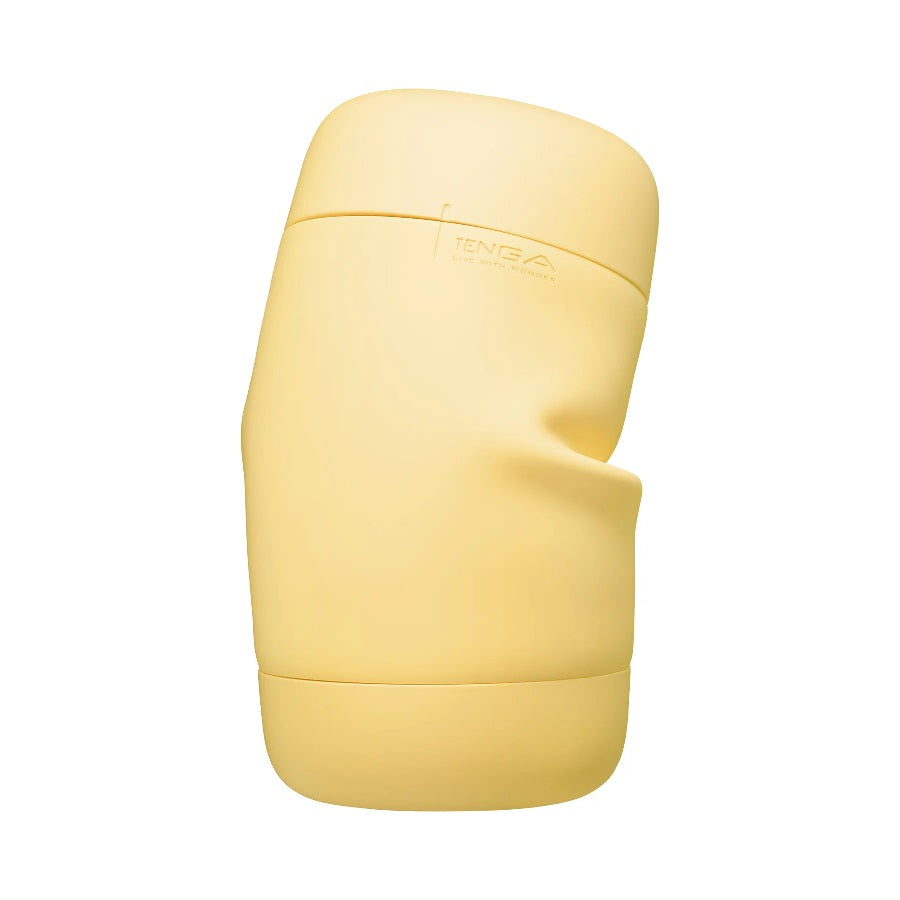 A yellow Tenga Puffy stroker with soft spiral ribs.