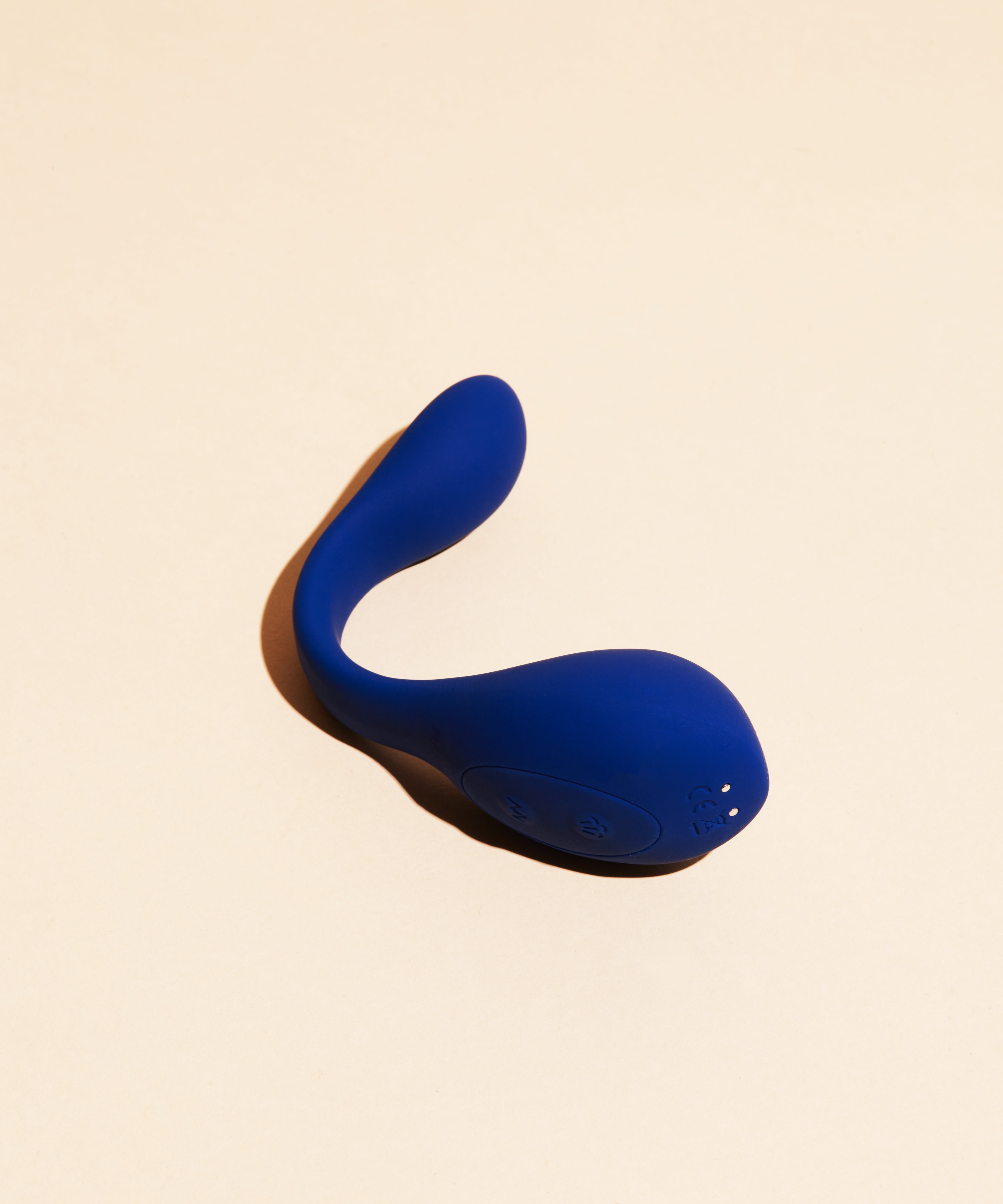 A blue silicone vibrator with buttons and CE marking.