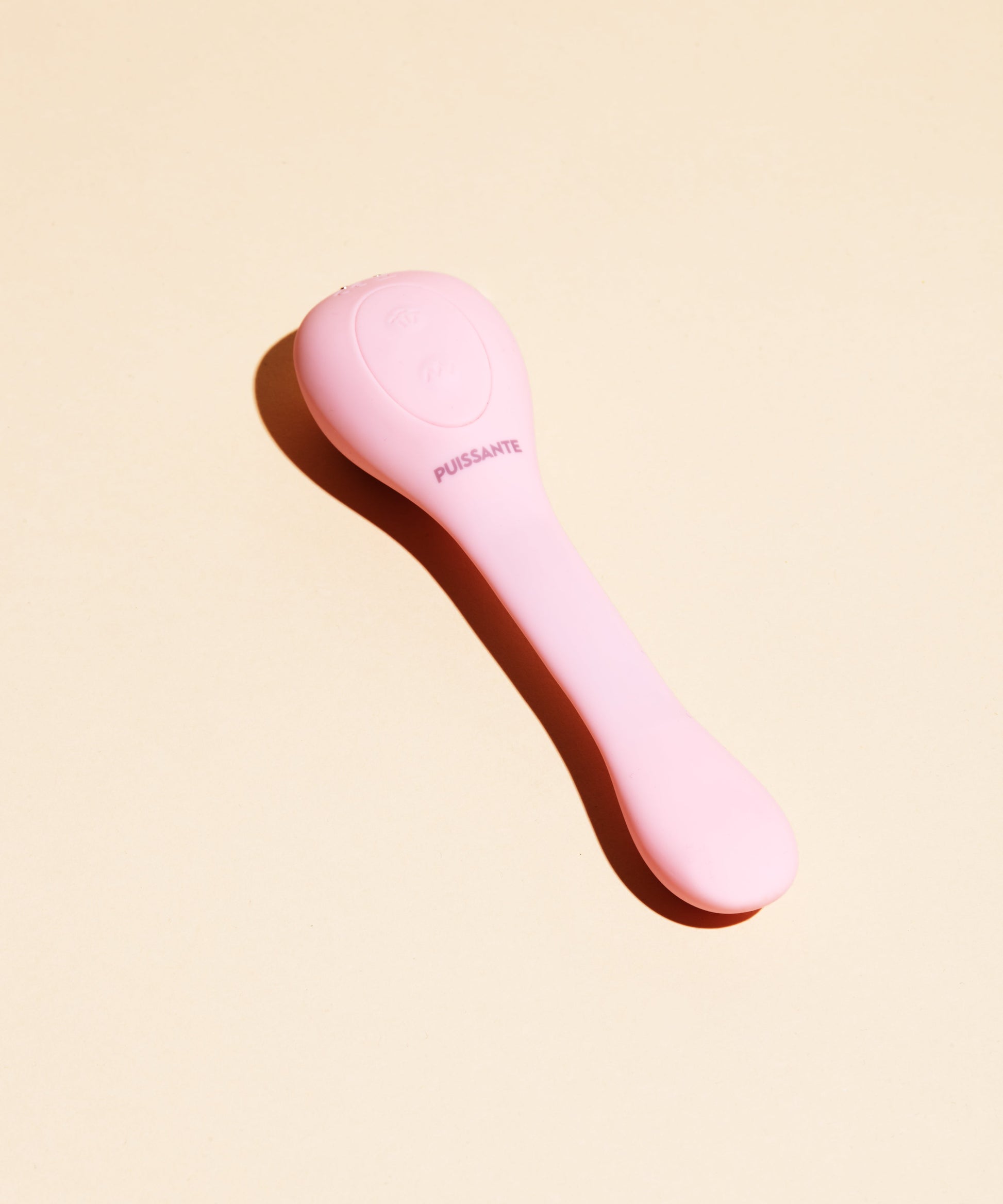 A pink dual stimulation vibrator with "PUISSANTE" text.
