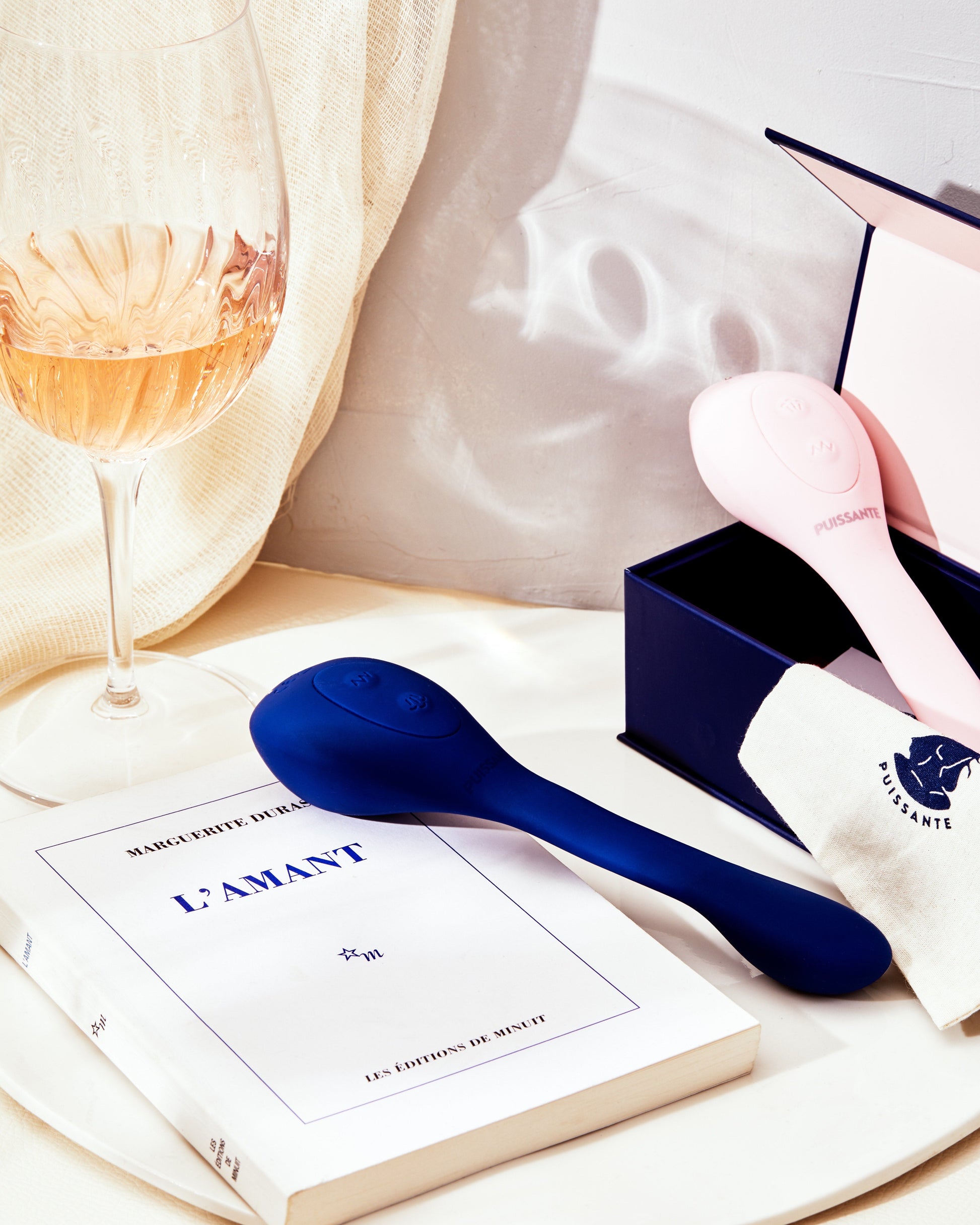 Pink dual stimulation vibrator with suction and vibration modes.