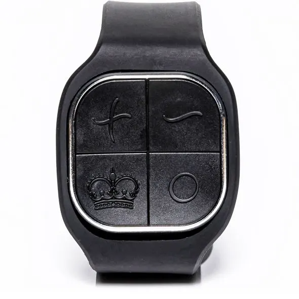 Black wearable remote with four buttons, including a crown symbol.