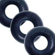 Three dark blue silicone cock rings with "ATOMIC-JOCK" embossed on them.