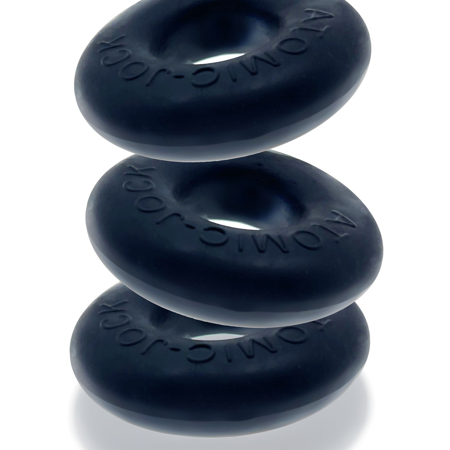 Three dark blue silicone cock rings stacked on a white background.