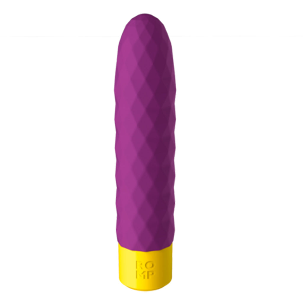 Purple bullet vibrator with a textured surface and yellow base.