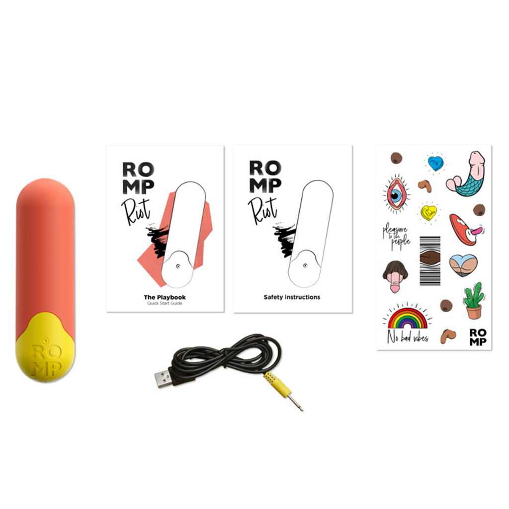 A red and yellow bullet vibrator with instructions, stickers, and a charging cable.
