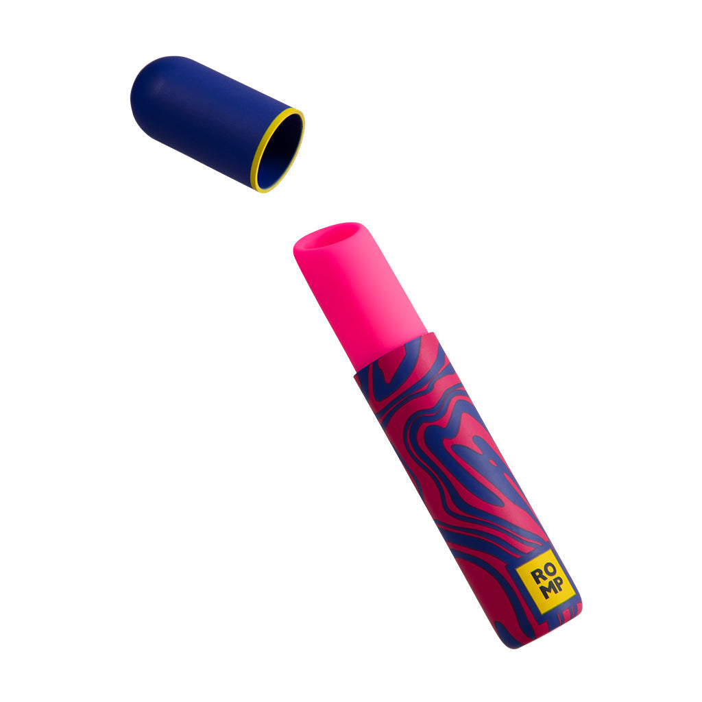 A pink lipstick clitoral stimulator with a blue cap and a wavy pattern.