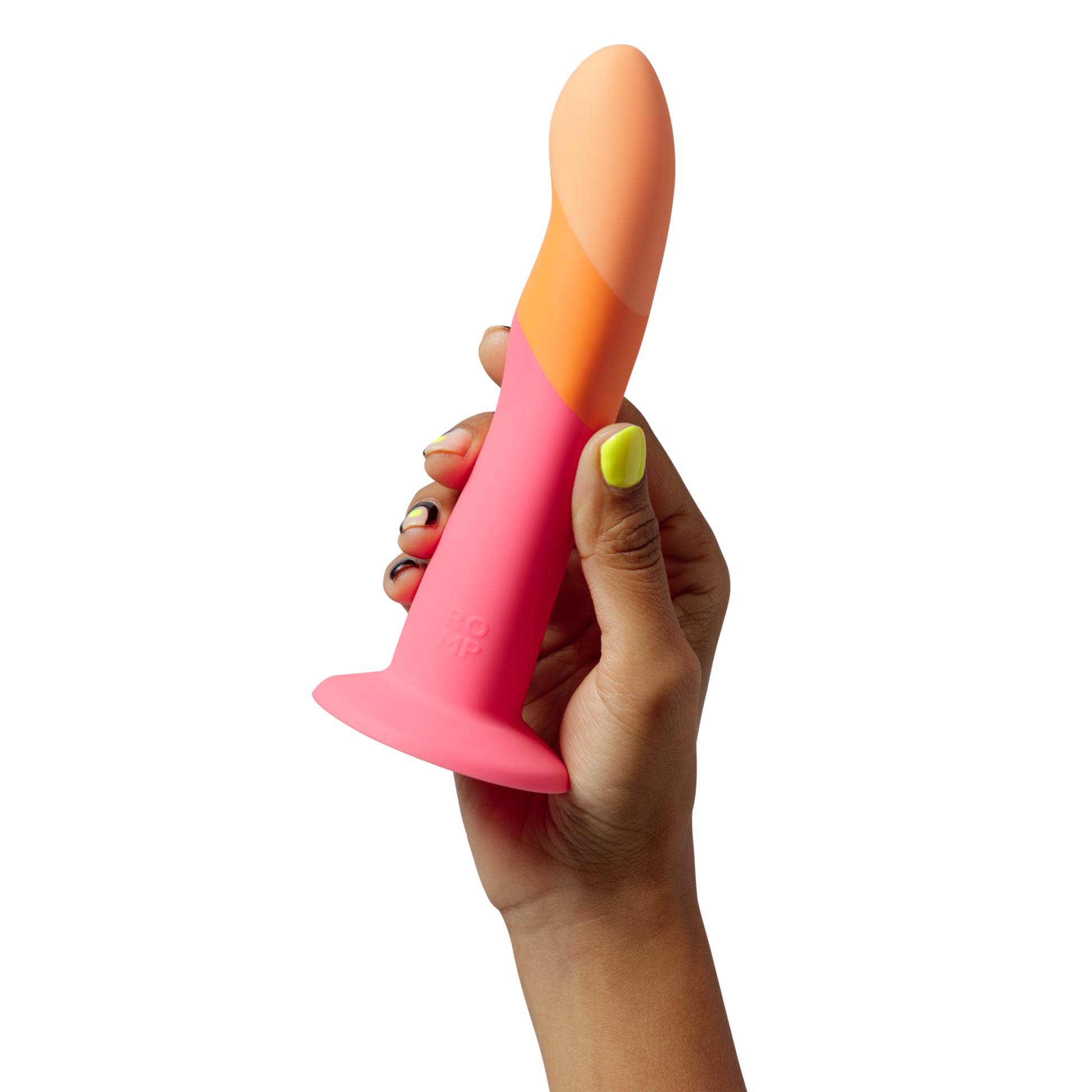 A hand holds a pink, orange, and peach curved silicone dildo with the ROMP logo.
