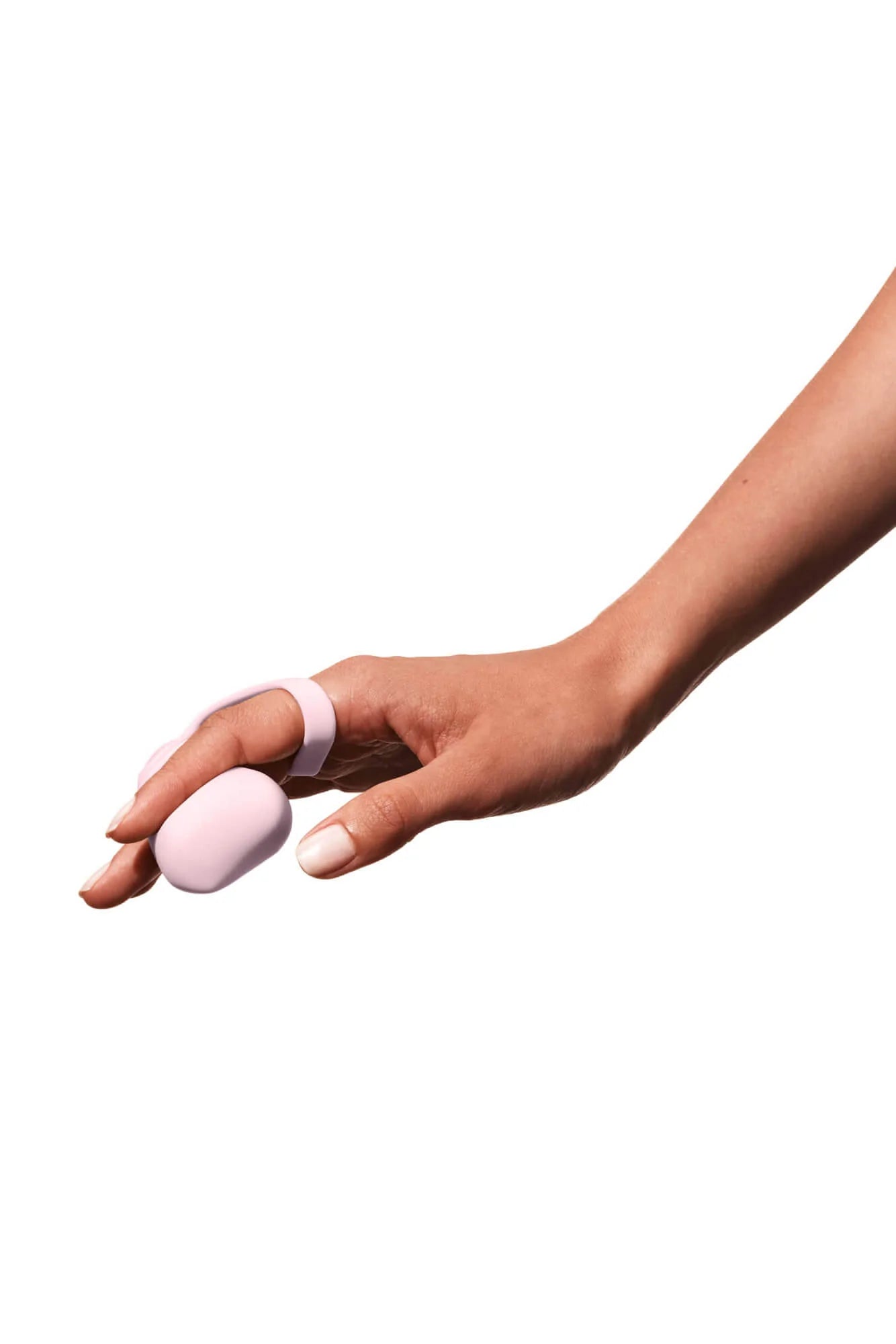 A pink silicone finger vibrator with a ring attachment on a hand.