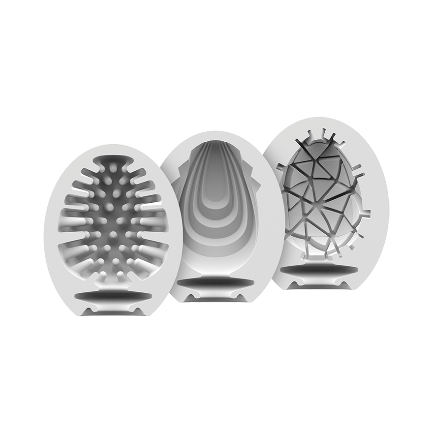 Three white masturbator eggs with different internal textures.