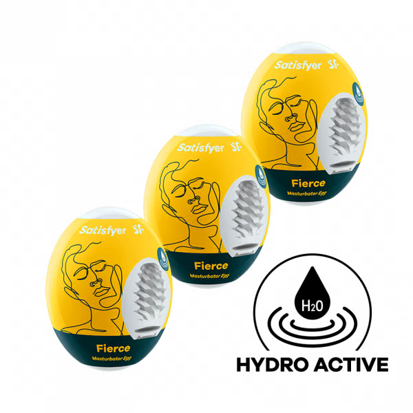 Three yellow Satisfyer Fierce masturbator eggs with abstract face designs.