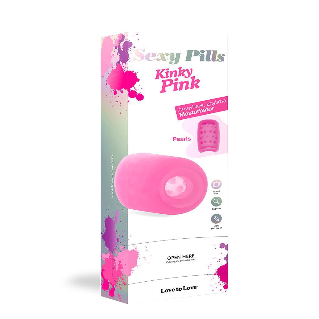 A pink pill-shaped male masturbator with textured interior.
