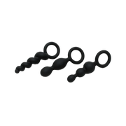 Three black silicone anal plugs with ring handles.