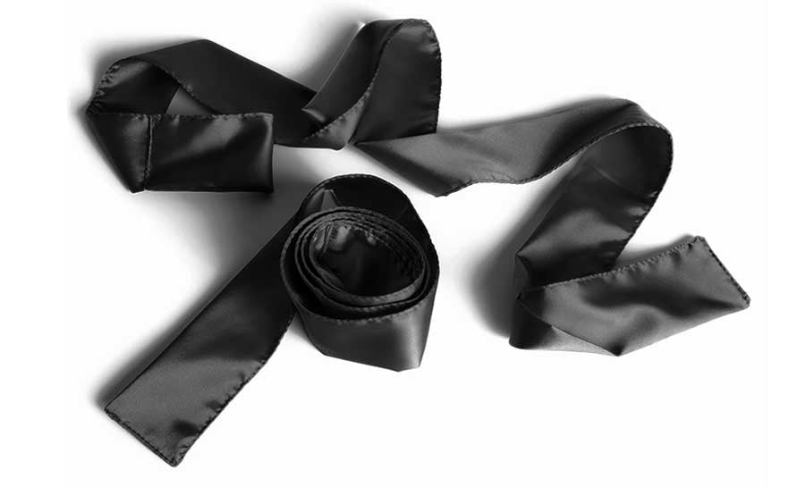 Black satin ribbon restraints and blindfold.