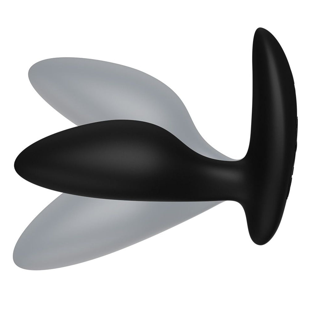 Black and grey silicone anal plug with a curved handle.