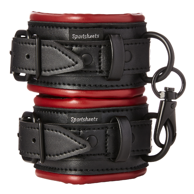 Black and red vegan leather wrist cuffs with adjustable straps and metal hardware.