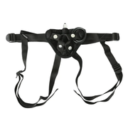 Black velvet strap-on harness with adjustable straps and three O-rings.
