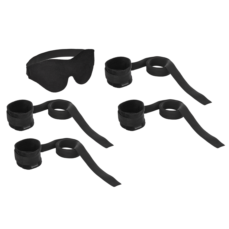 Black bondage restraint kit with blindfold and four wrist cuffs with straps.