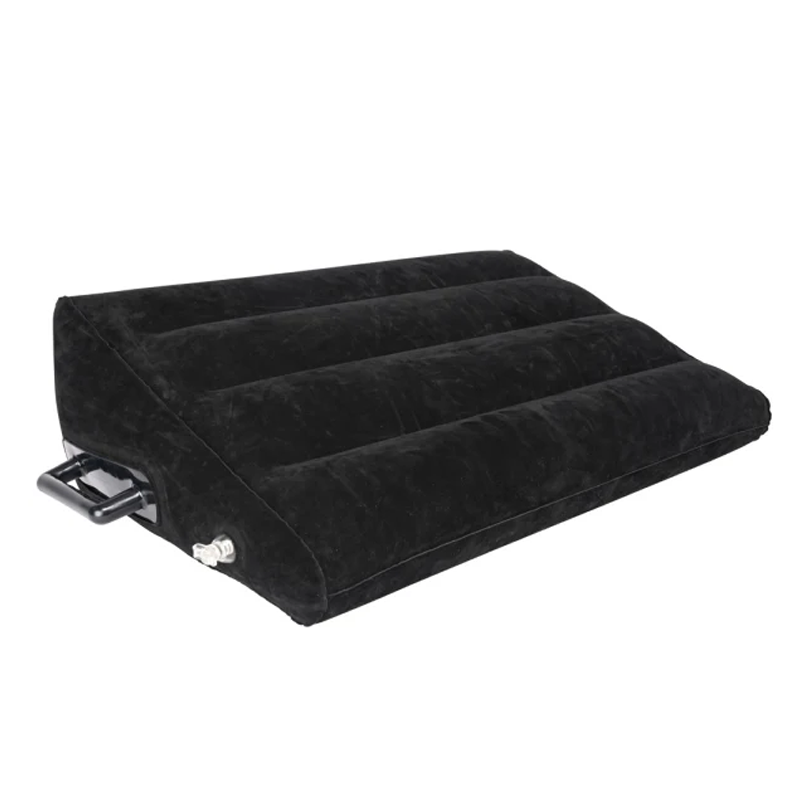 Black inflatable wedge pillow with velvet texture and handles.