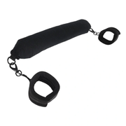 Black padded positioning bar with two restraint cuffs.