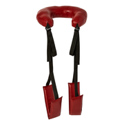 Red leather thigh sling with padded leg rests and black straps.