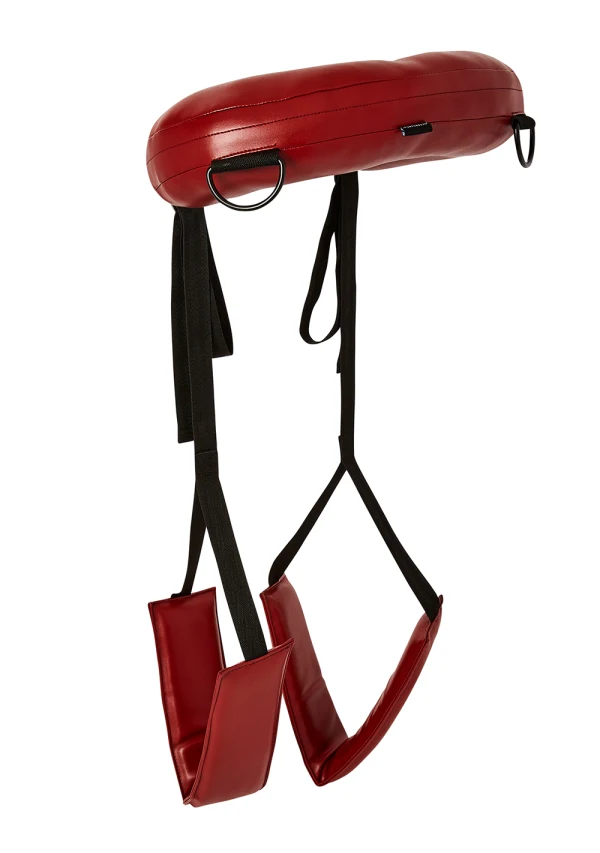 Red thigh sling with padded leg rests and black straps.