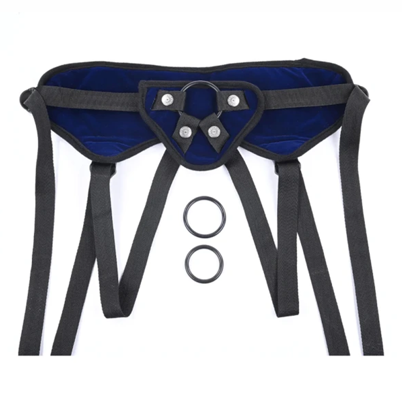 Blue velvet strap-on harness with black straps and metal rings.