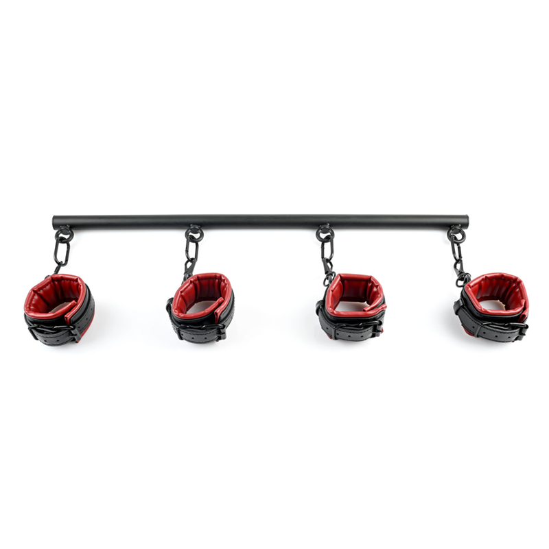 Black spreader bar with four red and black faux leather cuffs.