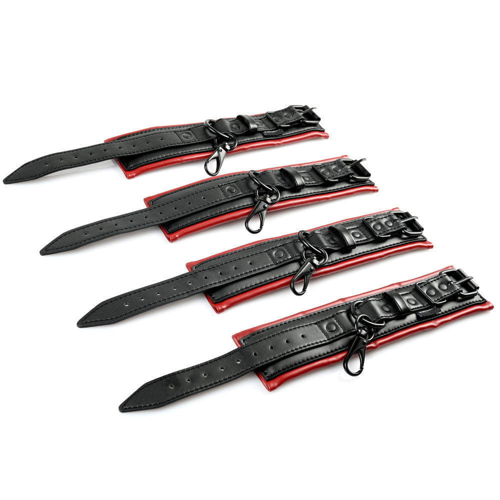 Four black and red faux leather cuffs with metal clips and buckles.