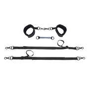 Black adjustable tethers and cuffs with a pivot connection.