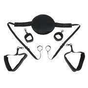 Black sex sling with pillow, wrist cuffs, and thigh straps.