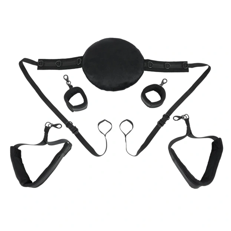 Black sex sling with pillow, wrist cuffs, and thigh straps.