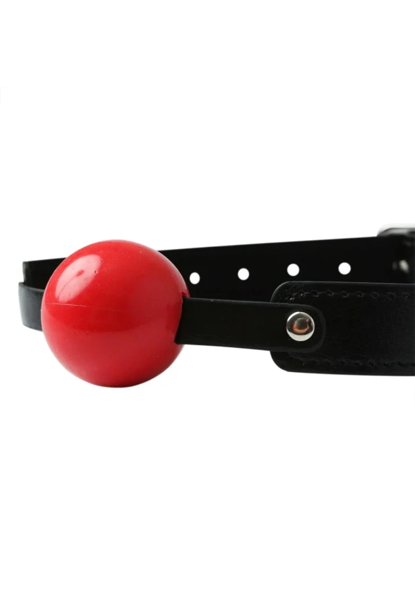 Red soft rubber ball gag with an adjustable black strap.