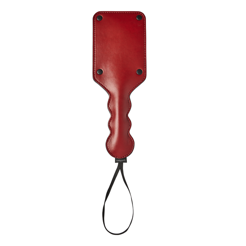 Red vegan leather square paddle with a wavy handle and wrist loop.