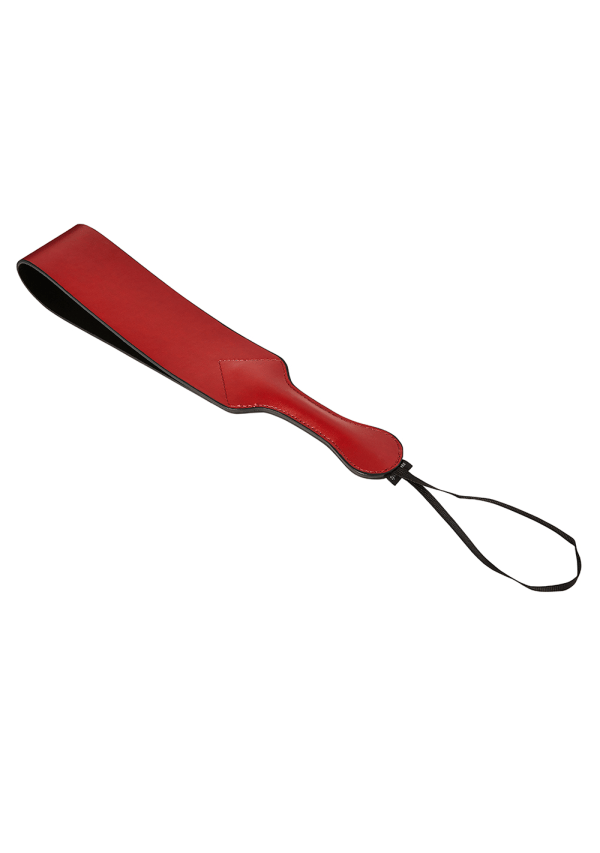 Red vegan leather paddle with a black loop and wrist strap.
