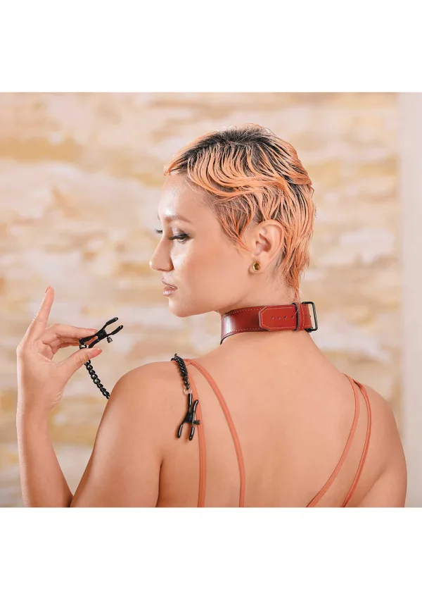 Saffron PU leather collar with black nipple clamps and chain.