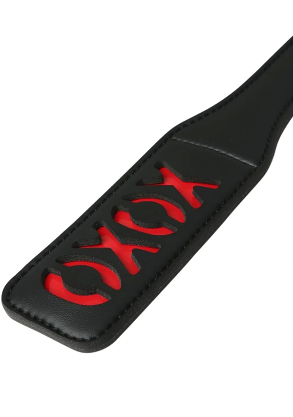 Black vinyl paddle with red XOXO cutouts.
