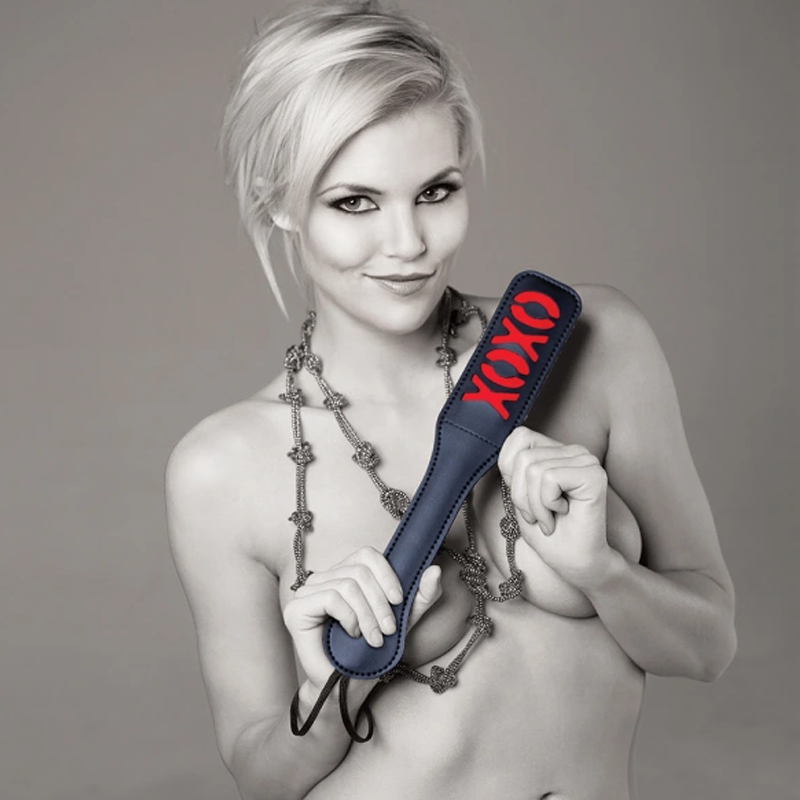 Black vinyl paddle with red XOXO design.