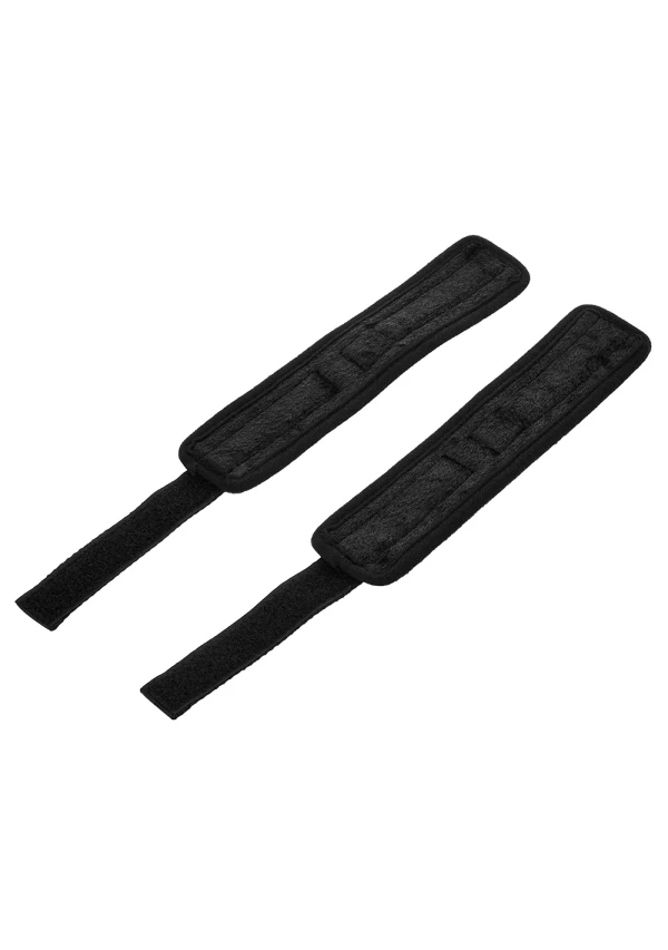 Two black, soft-lined wrist cuffs with hook and loop closures.