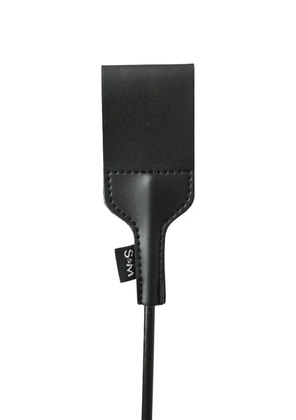 Black vegan leather riding crop with an S&M tag.