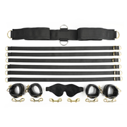 Black restraint set with faux leather cuffs, blindfold, and adjustable straps.