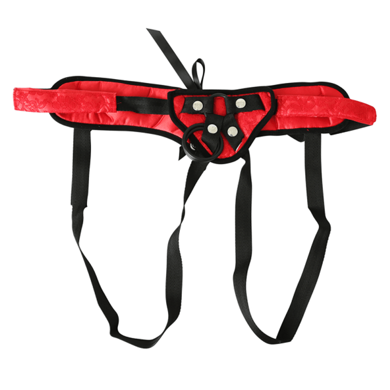 Red lace harness with black straps and a metal O-ring.
