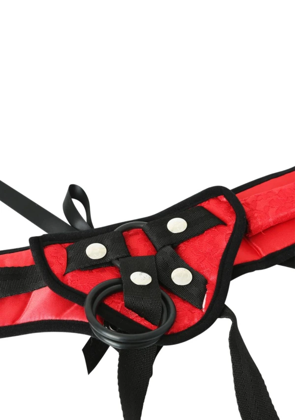 Red lace corset strap-on harness with black straps and silver studs.