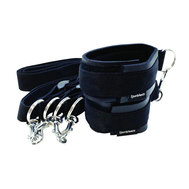 Black adjustable cuffs and tethers with metal clips.