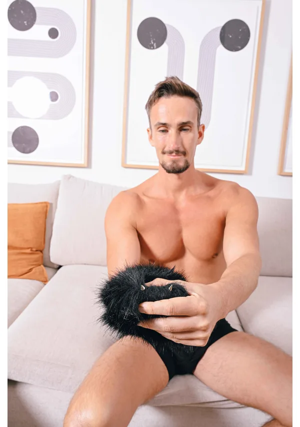 Black faux fur sensory mitt with spikes.