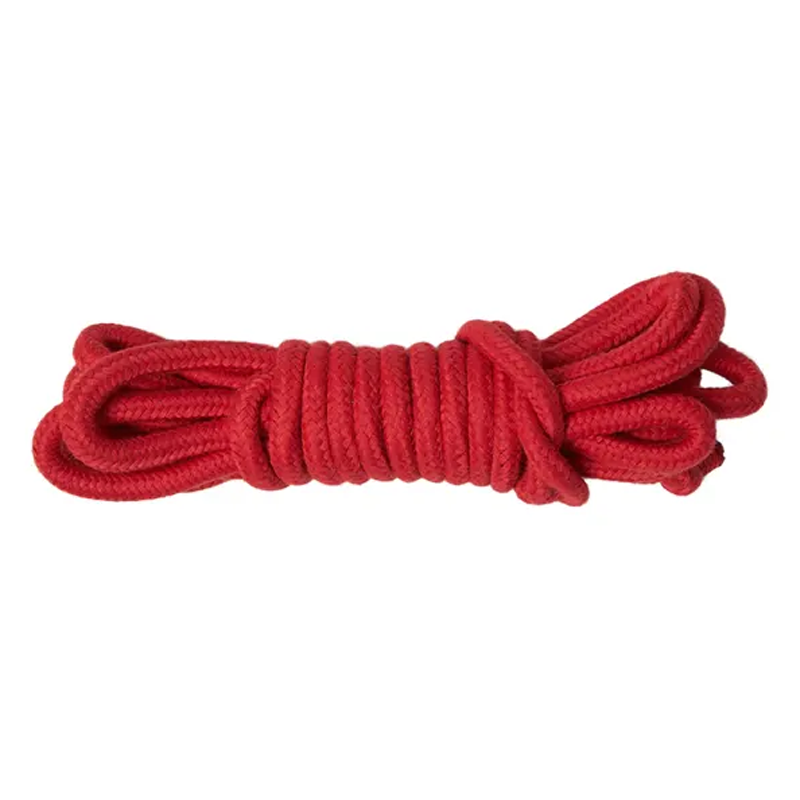 A coiled red cotton rope on a white background.
