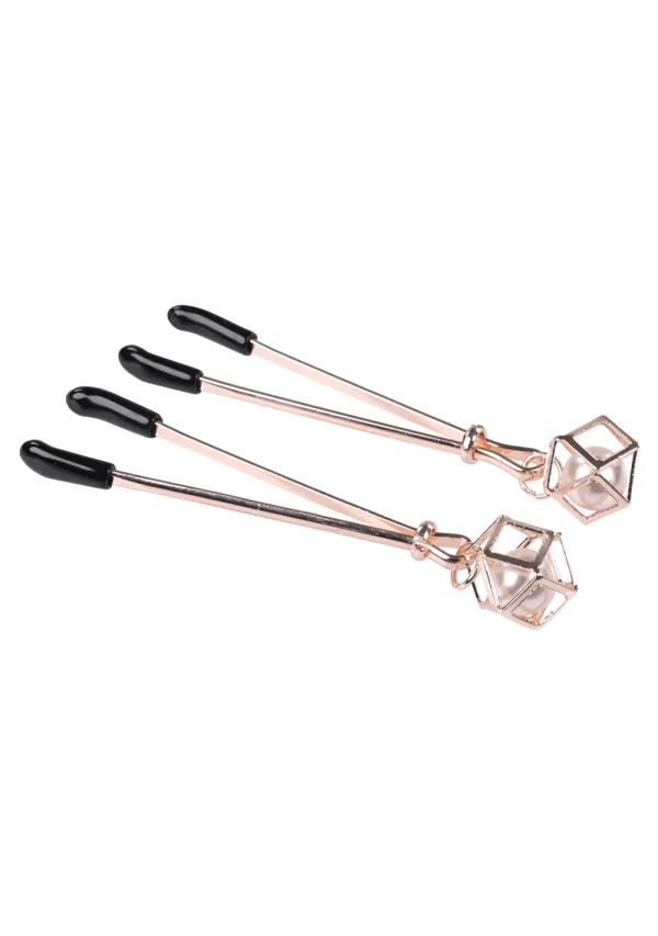 Rose gold nipple clips with black tips and pearl cage charms.